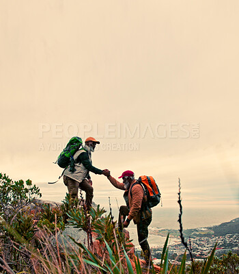 Buy stock photo Space, helping hand and friends hiking with support for climbing on mountain or hill in nature. Mockup, walking and hikers on adventure for assistance, travel and freedom of teamwork, sky and trust