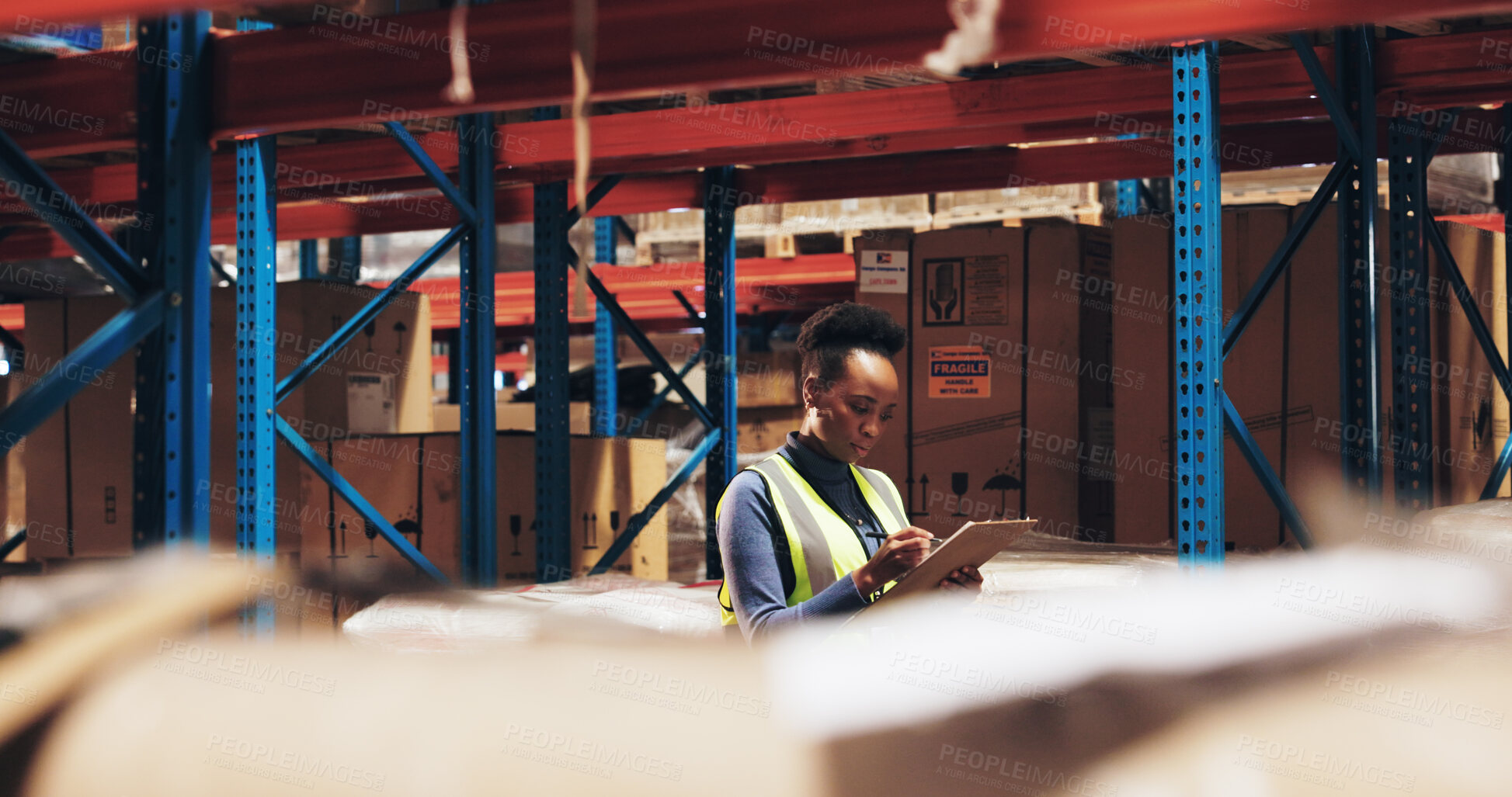 Buy stock photo Black woman, supplier and inventory with checklist in logistics for quality control or checking stock at warehouse. Young African, distributor or manager writing for counting shipment in storage