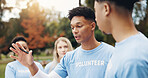 Discussion, volunteer and man with team in park together planning for sustainable green project. Collaboration, men and women in circle for outdoor management, community care or social responsibility