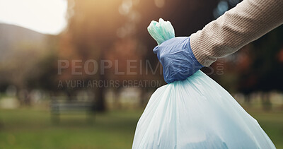 Buy stock photo Park, volunteer and hand of person with bag for trash collection, sustainability and green ngo project. Cleaning, nature and worker with plastic for garbage, community care or social responsibility