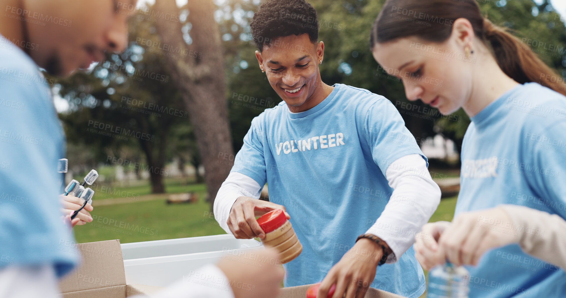 Buy stock photo Donation, volunteering and group of people in park together for sustainability, teamwork and ngo box project. Solidarity, men and women at table for outdoor charity, community care and food package