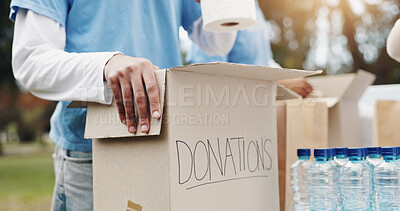 Buy stock photo Boxes, charity and volunteer in event, hands and people in ngo with kindness, donations and service. Outdoor, team and social responsibility for poverty, nonprofit and gift for help in community