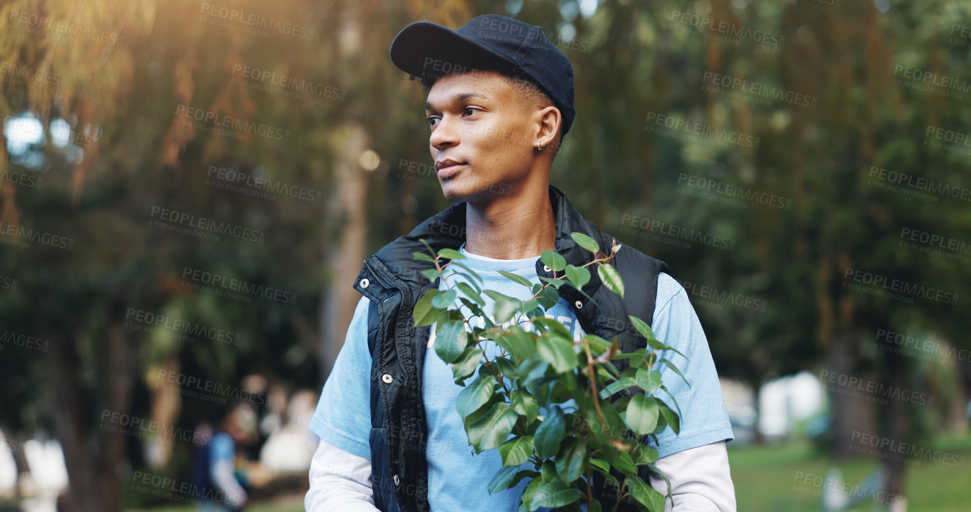 Buy stock photo Help, volunteer and man in park with plant for growth, development or support on earth day. Green, woods and person thinking in nature for sustainability, climate change and social responsibility