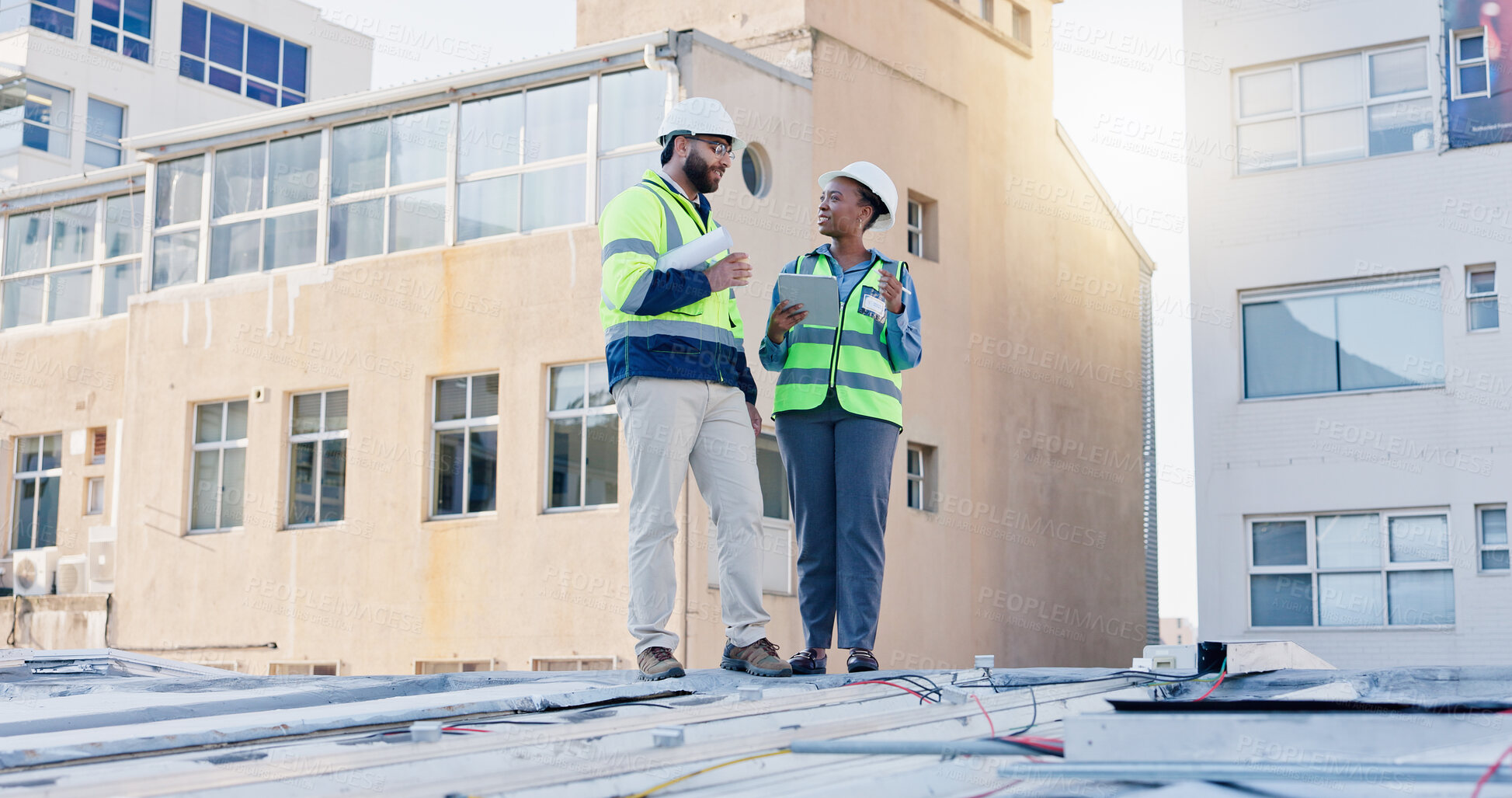 Buy stock photo Business people, technician and discussion with tablet on rooftop for building maintenance or installation in city. Contractor, electrical engineer or electricians with technology for roof inspection