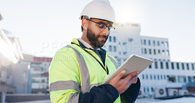 Buy stock photo Man, engineer or tablet on rooftop for construction planning, building maintenance or architecture. Contractor, typing or tech for project management in city for infrastructure development feedback