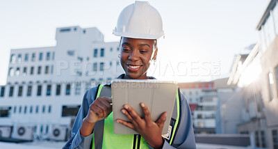 Buy stock photo Black woman, engineer and tablet on rooftop for construction planning, building maintenance and architecture. Contractor, typing and tech for project management in city for development feedback