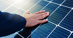 Solar panel, person and hand with light for renewable energy, alternative power or photovoltaic system. Closeup, electrician and electrical heat grid with ray for eco friendly resource or electricity