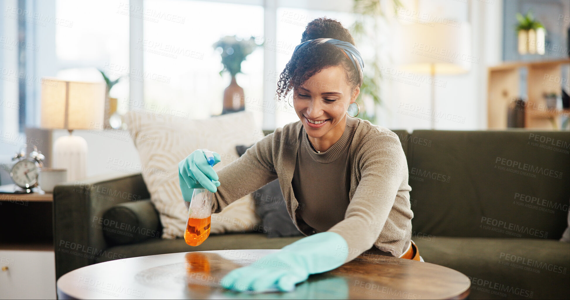 Buy stock photo Spray, happy woman and cleaning table in home living room for hygiene, maintenance or housekeeping service. Wipe surface, smile or chores with product on wood with chemical for bacteria, dirt or dust