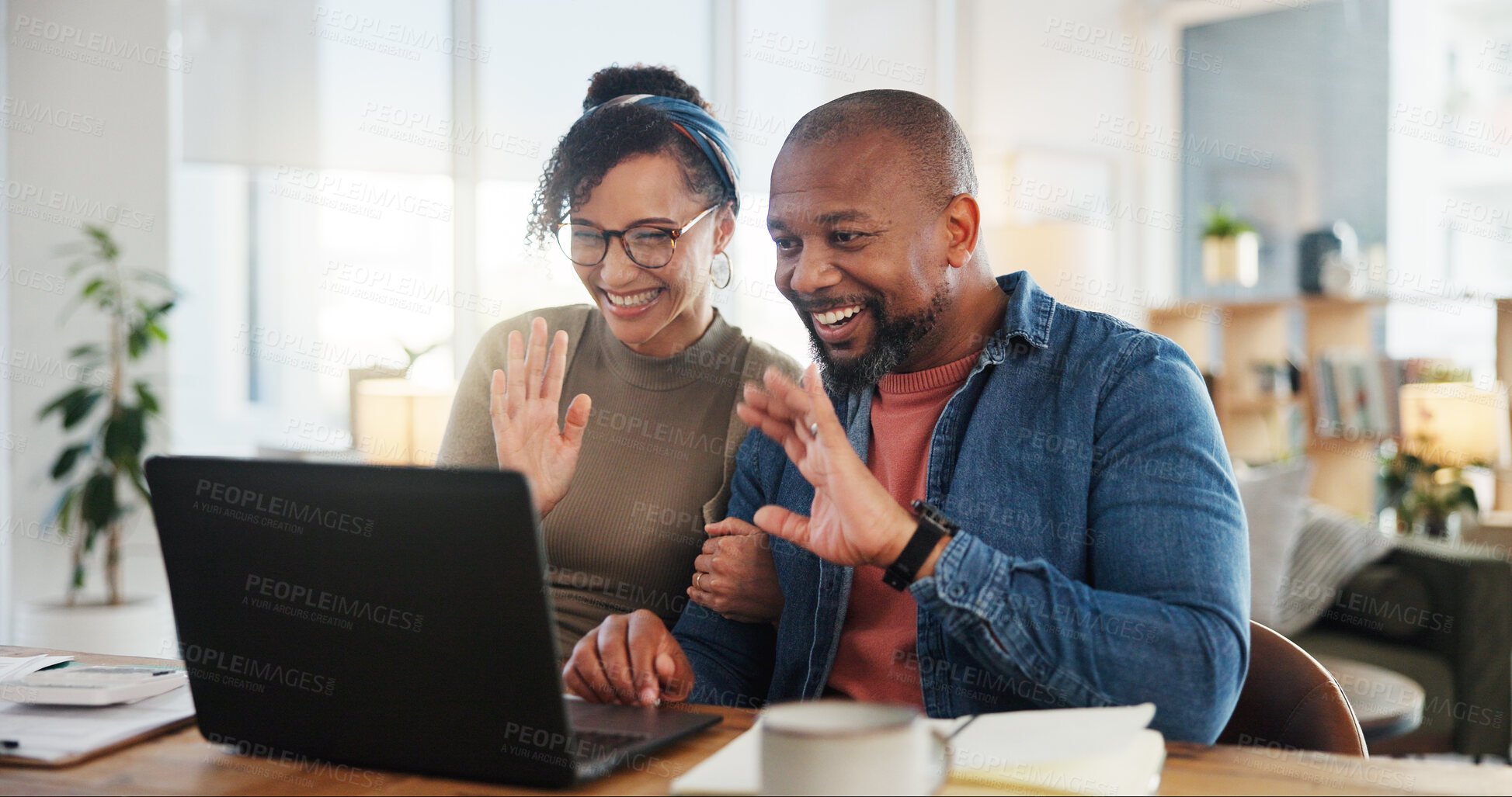 Buy stock photo Couple, wave and laptop in home for video call, hello or communication on internet. People, happy or tech in living room for contact, connectivity or live streaming at table for distant family update