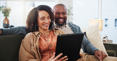 Buy stock photo Couple, smile and relax with tablet on sofa for online order, communication and discussion for lunch. Interracial, woman and man with technology at home for takeout app, decision and delivery of food