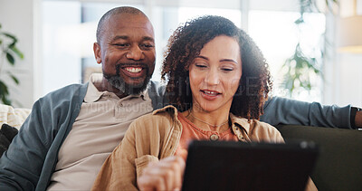 Buy stock photo Couple, relax and conversation with tablet on sofa for food delivery, online order and decision on lunch. Interracial, man and woman with tech at home for takeout app, discussion and menu information