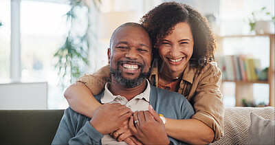 Buy stock photo Couple, laughing and hug portrait in home for romance, support and commitment in marriage with love. Interracial people, security and embrace in living room of house for loyalty, comfort or affection