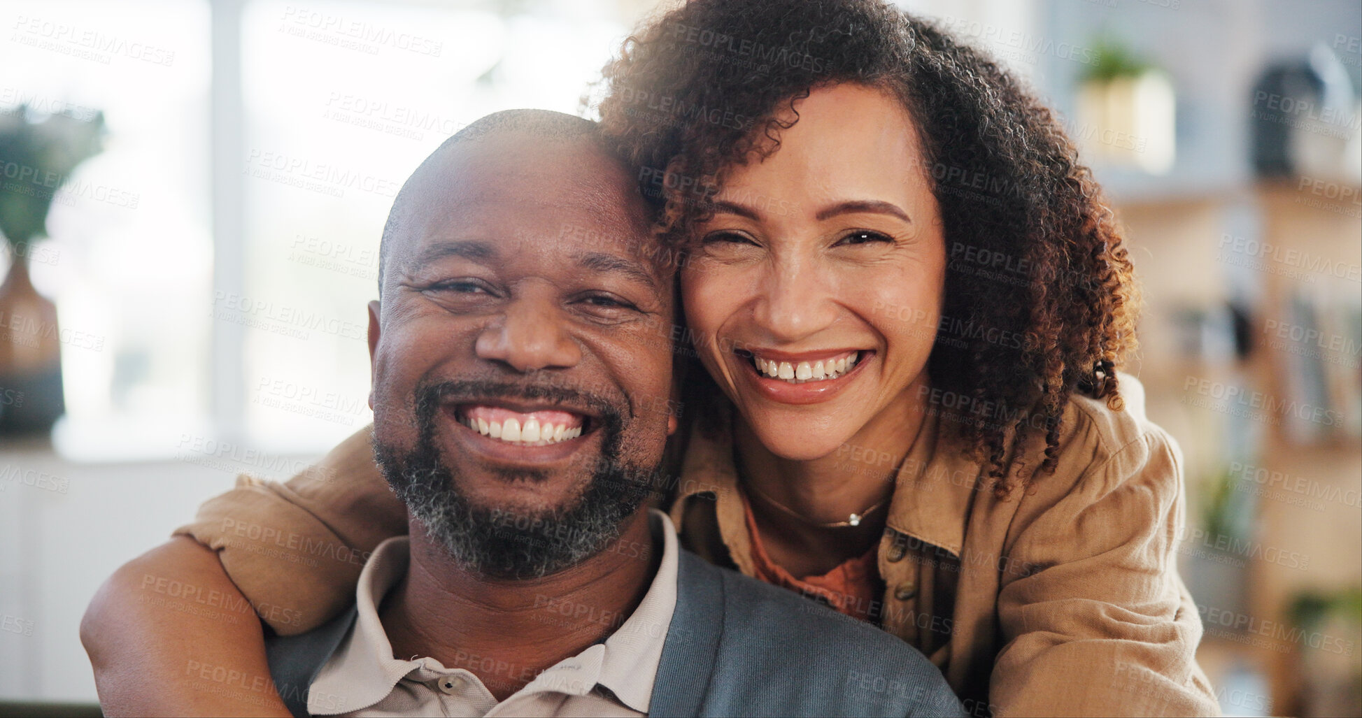 Buy stock photo Couple, happy and hug portrait in home for romance, support and commitment in marriage with love. Interracial people, security and embrace in living room of house for loyalty, comfort and affection