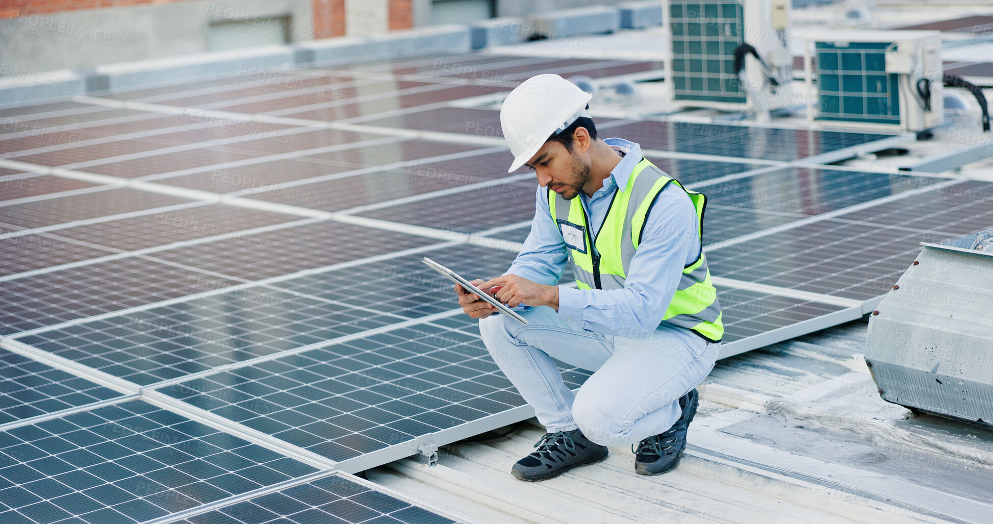 Buy stock photo Technician, man and tablet for solar panels, electricity and eco friendly or heating of energy saving grid on rooftop. Engineering, digital technology and photovoltaic inspection for installation