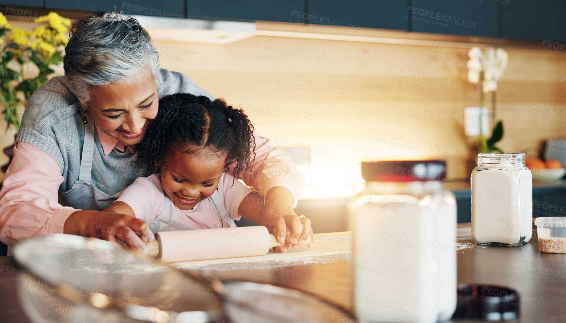 Buy stock photo Grandma, little girl and baking with roller on table in kitchen for learning, teaching or making dough at home. Happy grandmother, child or junior baker preparing dessert, cookies or pastry recipe