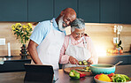 Senior, happy couple or tablet for cooking recipe method, dinner or guide in home or interracial marriage. Online tutorial, laughing or people with ingredients instruction, food or meal prep steps