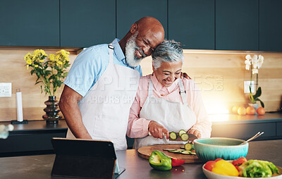 Buy stock photo Senior, happy couple or tablet for cooking recipe method, dinner or guide in home or interracial marriage. Online tutorial, laughing or people with ingredients instruction, food or meal prep steps