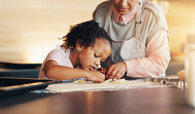 Buy stock photo Grandparent, little girl and baking with cookie cutter on table in kitchen for learning, teaching or making dough at home. Grandma, child or junior baker with shapes for dessert or recipe at house