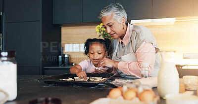 Buy stock photo Baking, child and grandmother helping with cookies for decoration, learning and childhood development. How to, baker woman and girl bonding in kitchen with teaching cake recipe, support and education