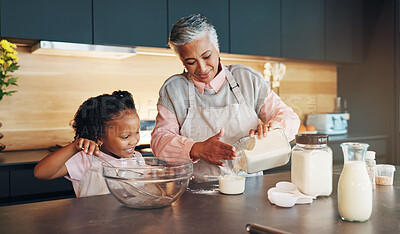 Buy stock photo Baking, kid and helping grandmother with preparation for cookies, dessert and childhood development. Flour, baker woman and girl bonding in kitchen with teaching cake recipe, support and education