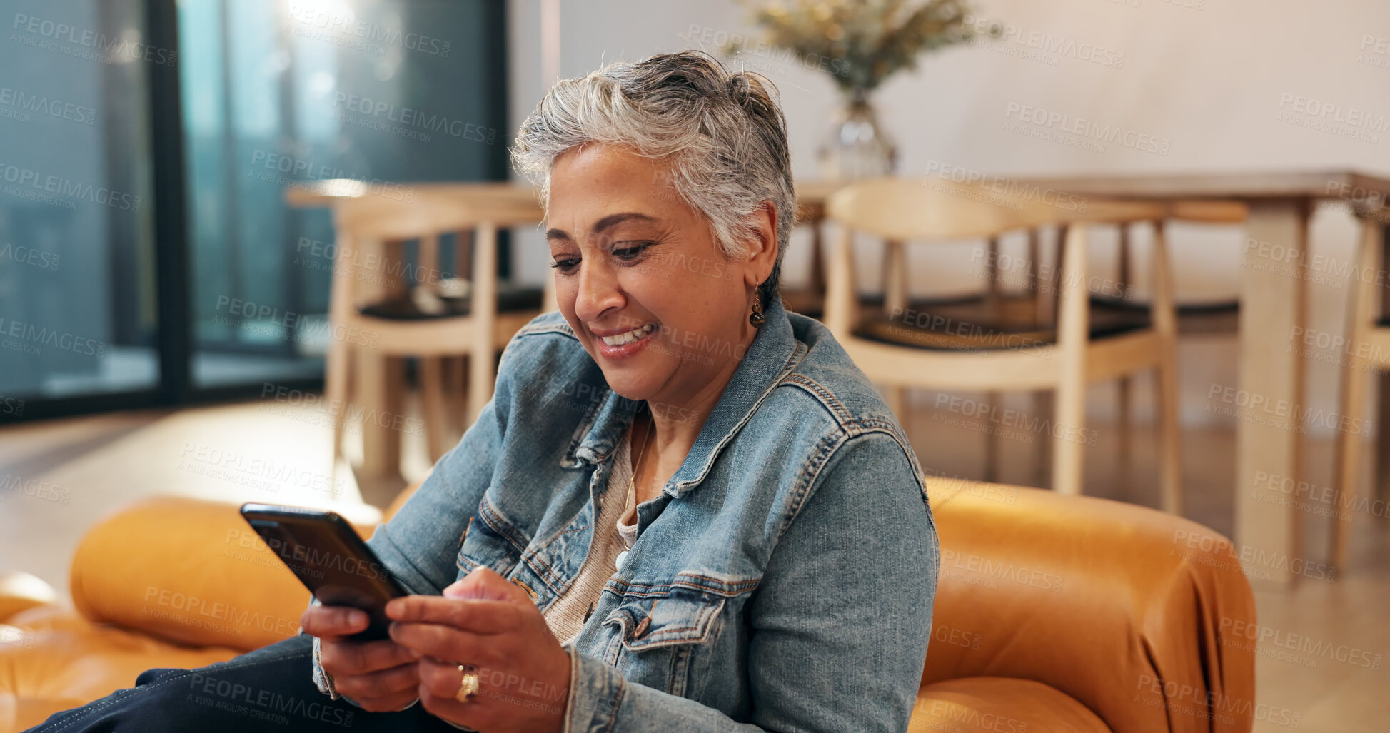 Buy stock photo Mature, woman and typing on sofa with phone for text message, communication or dating site in home. Happy person, relax and smartphone for social media, online browsing and check email notification