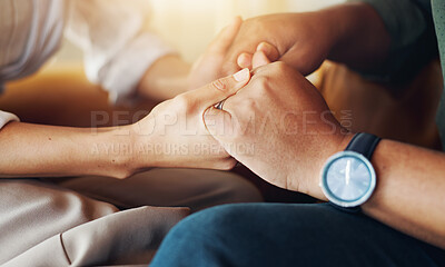 Buy stock photo Holding hands, love and couple on sofa with support for marriage counseling together with bonding. Care, empathy and closeup of man and woman with connection to fix relationship problem in therapy.