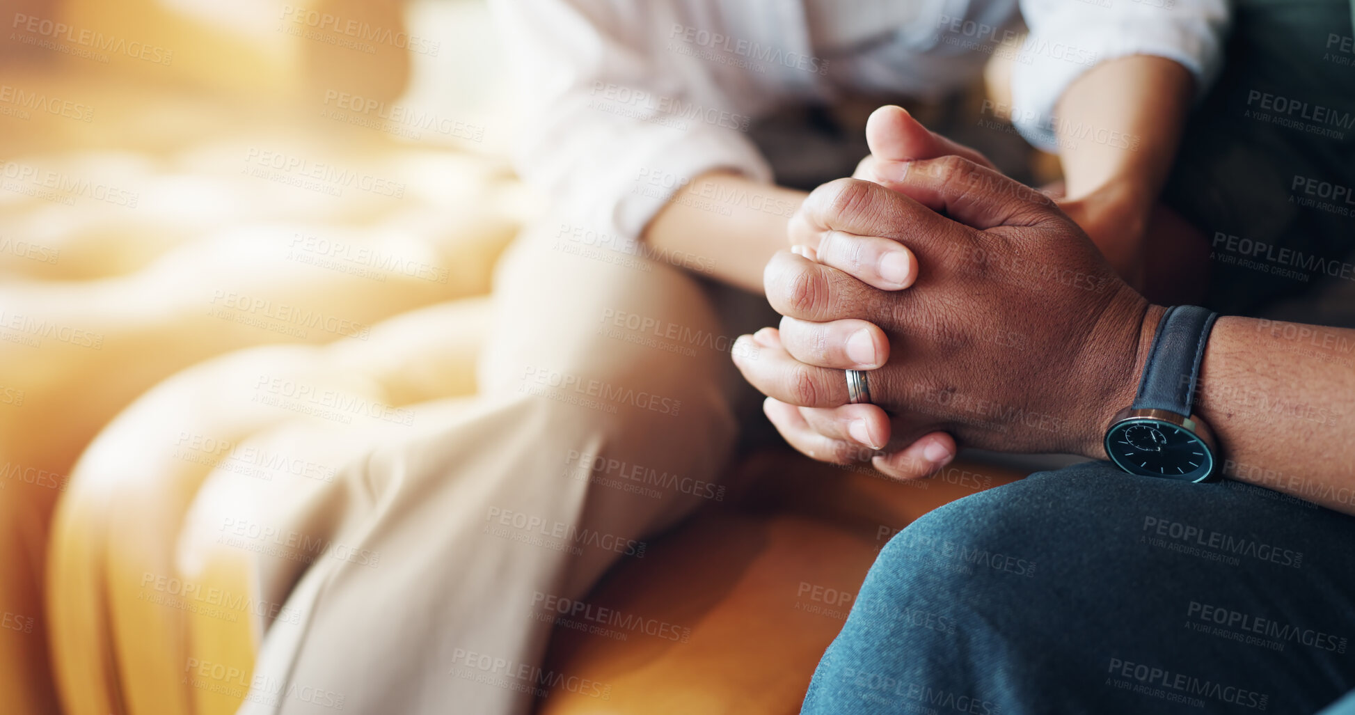 Buy stock photo Holding hands, care and couple on sofa with support for marriage counseling together with bonding. Love, empathy and closeup of man and woman with connection to fix relationship problem in therapy.