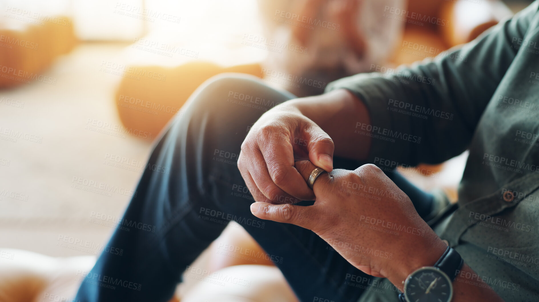 Buy stock photo Wedding ring, anxiety and hands of man on sofa for guilt of divorce, cheating or infidelity. Nervous, jewelry and closeup of male person with marriage breakup, separation or problem at counselling.