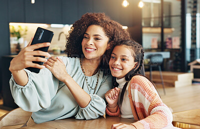 Buy stock photo Mom, girl and selfie with smile in home with care, connection and bonding with photography, love and post on web. Memory, mother and daughter with profile picture, happy and social network in house