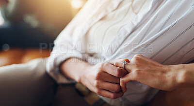 Buy stock photo Wedding ring, anxiety and hands of woman on sofa for guilt of divorce, cheating or infidelity. Nervous, jewelry and closeup of female person with marriage breakup, separation or problem at home.