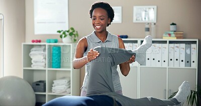 Buy stock photo Physiotherapy, stretching leg and black woman with patient for wellness, health and mobility. Healthcare, clinic and chiropractor with person for physical therapy, rehabilitation and medical support