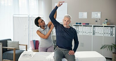 Buy stock photo Physiotherapy, stretching arm and woman with senior man for wellness, health and mobility. Healthcare, clinic and chiropractor with patient for physical therapy, rehabilitation and medical support