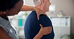 Physiotherapy, shoulder pain and senior man with chiropractor for wellness, health and mobility. Healthcare, clinic and person with patient for physical therapy, rehabilitation and medical support