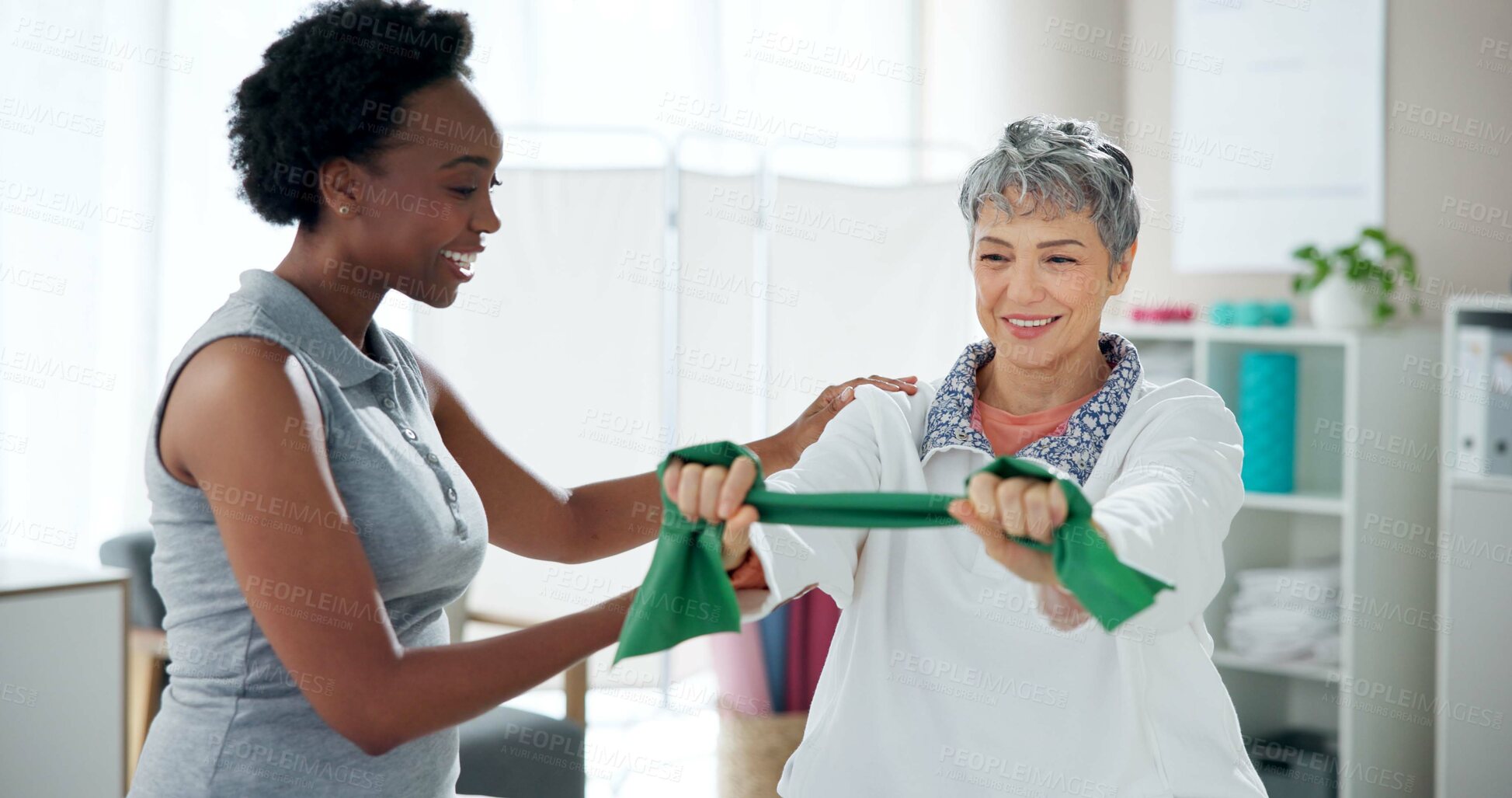 Buy stock photo Physiotherapy, stretching and mature woman with resistance band for wellness, health and mobility. Healthcare, clinic and chiropractor with patient for physical therapy, rehabilitation and consulting