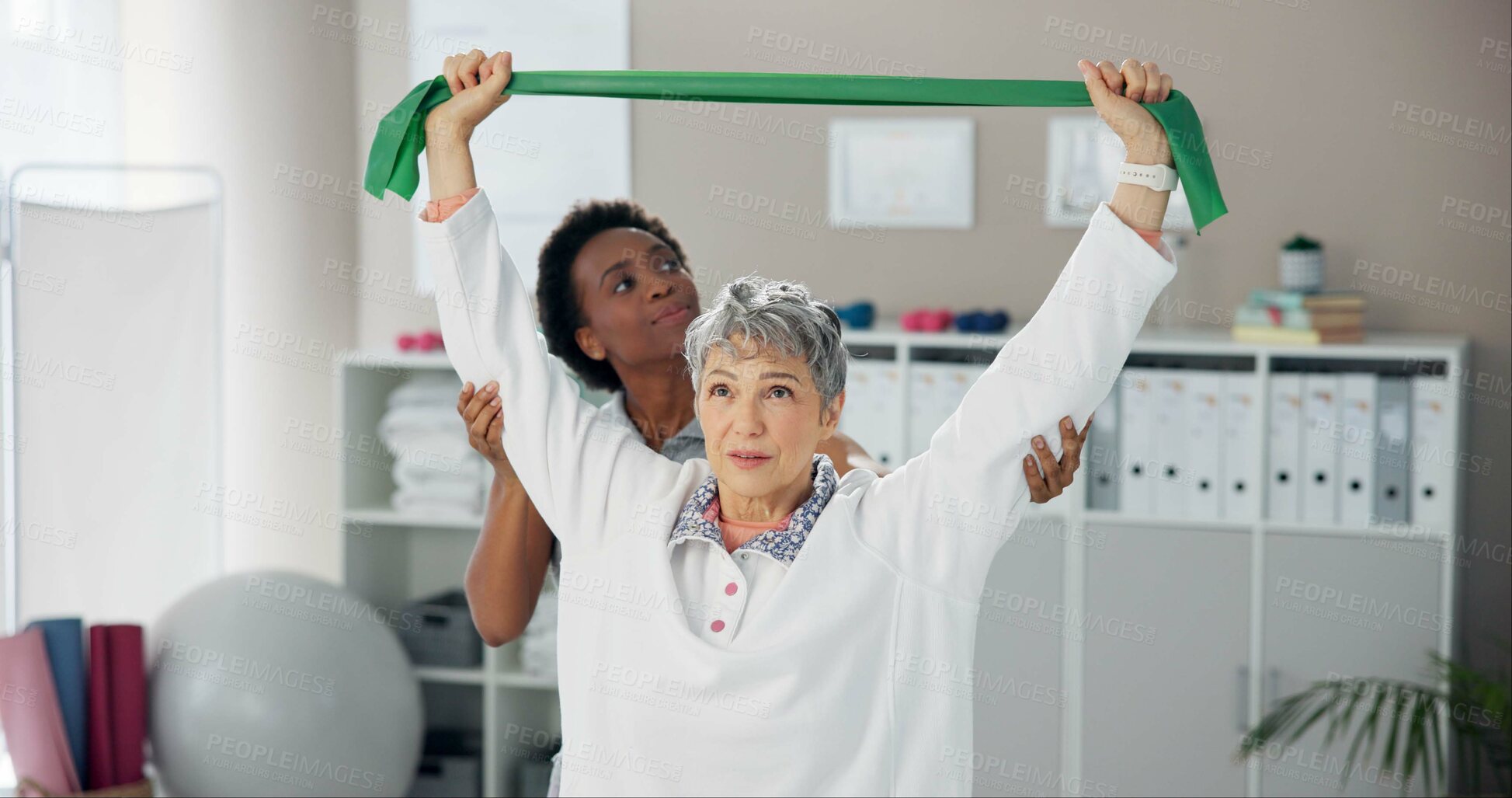 Buy stock photo Physiotherapy, resistance band and woman stretching for wellness, health and mobility. Healthcare, consulting and chiropractor with patient for physical therapy, rehabilitation and medical support