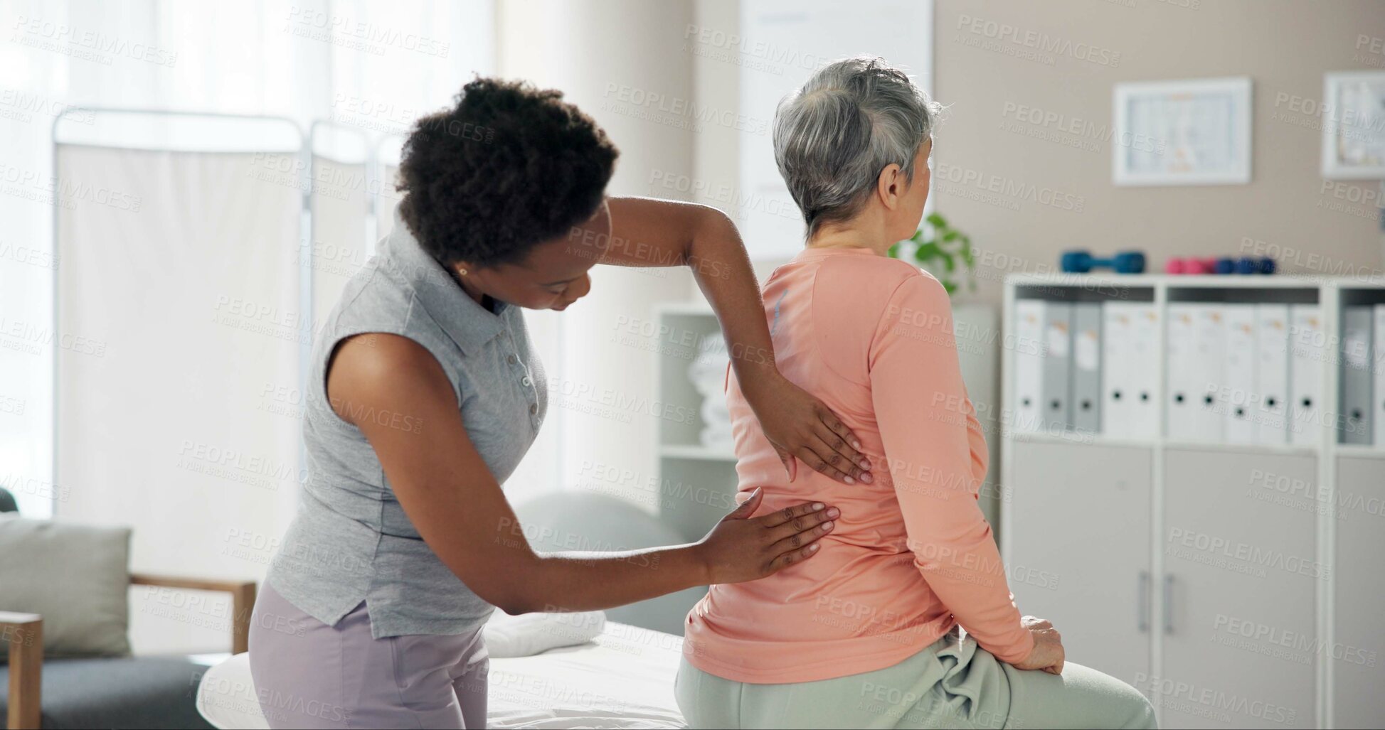 Buy stock photo Woman, physiotherapist and patient with back pain for injury or medical consultation at clinic. Female person, orthopedic and senior client with sore spine, ache or muscle tension at private practice