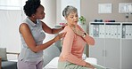 Woman, physiotherapist and patient with shoulder pain for medical consultation or injury at clinic. Female person, orthopedic and senior client with sore muscle, ache or tension at private practice