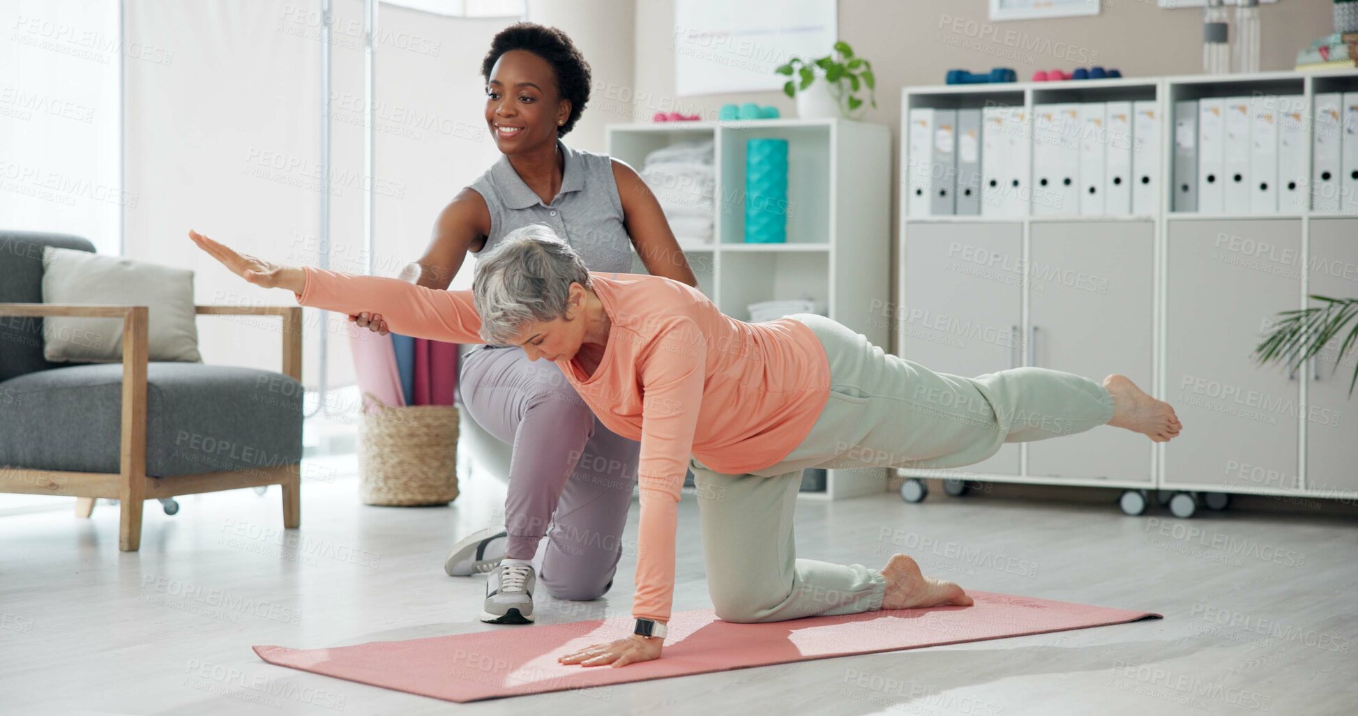 Buy stock photo Happy woman, physiotherapist and senior stretching with personal trainer for yoga, workout or exercise at clinic. Female person, physio or phyiscal therapist helping elderly patient in pilates on mat