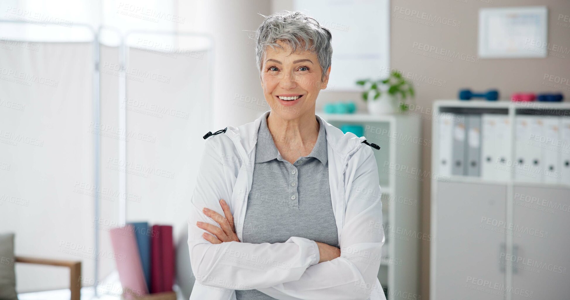 Buy stock photo Portrait, physiotherapy and old woman in clinic, arms crossed and happiness with career ambition. Face, physical therapist and medical with professional, wellness and smile with pride and healthcare