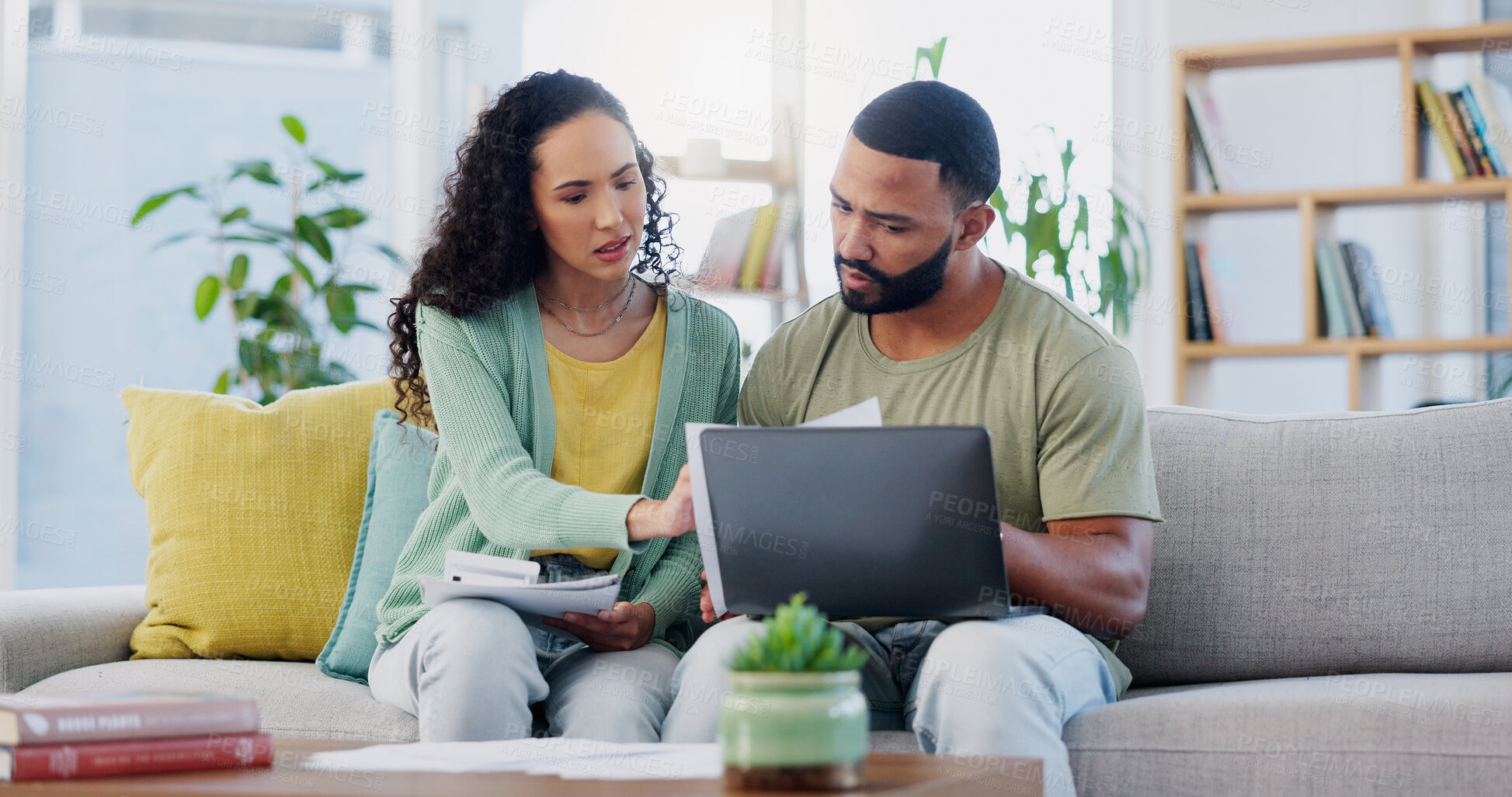 Buy stock photo Frustrated couple, finance and documents with laptop on sofa for expenses, bills or financial problems at home. Young, man and woman with paperwork on computer for debt, mortgage or invoices at house