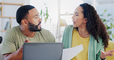 Buy stock photo Frustrated couple, stress and argument with laptop for expenses, bills or financial crisis on sofa at home. Young man, woman or fight with finance, paperwork or invoices for debt or mortgage at house