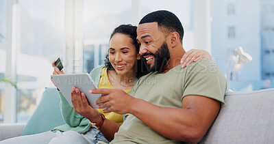 Buy stock photo Happy couple, relax and tablet with credit card on sofa for ecommerce, payment or banking app at home. Man, woman or shoppers with smile on technology for online shopping, transaction or purchase