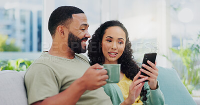 Buy stock photo Happy couple, relax and browsing with phone on sofa for social media, online shopping or connectivity at home. Young, man and woman with coffee or mobile smartphone for internet connection at house