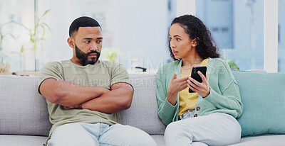 Buy stock photo Phone, cheating and couple with argument on sofa in living room for divorce, affair or breakup. Cellphone, upset and young man and woman fighting for text with online infidelity on dating app in home