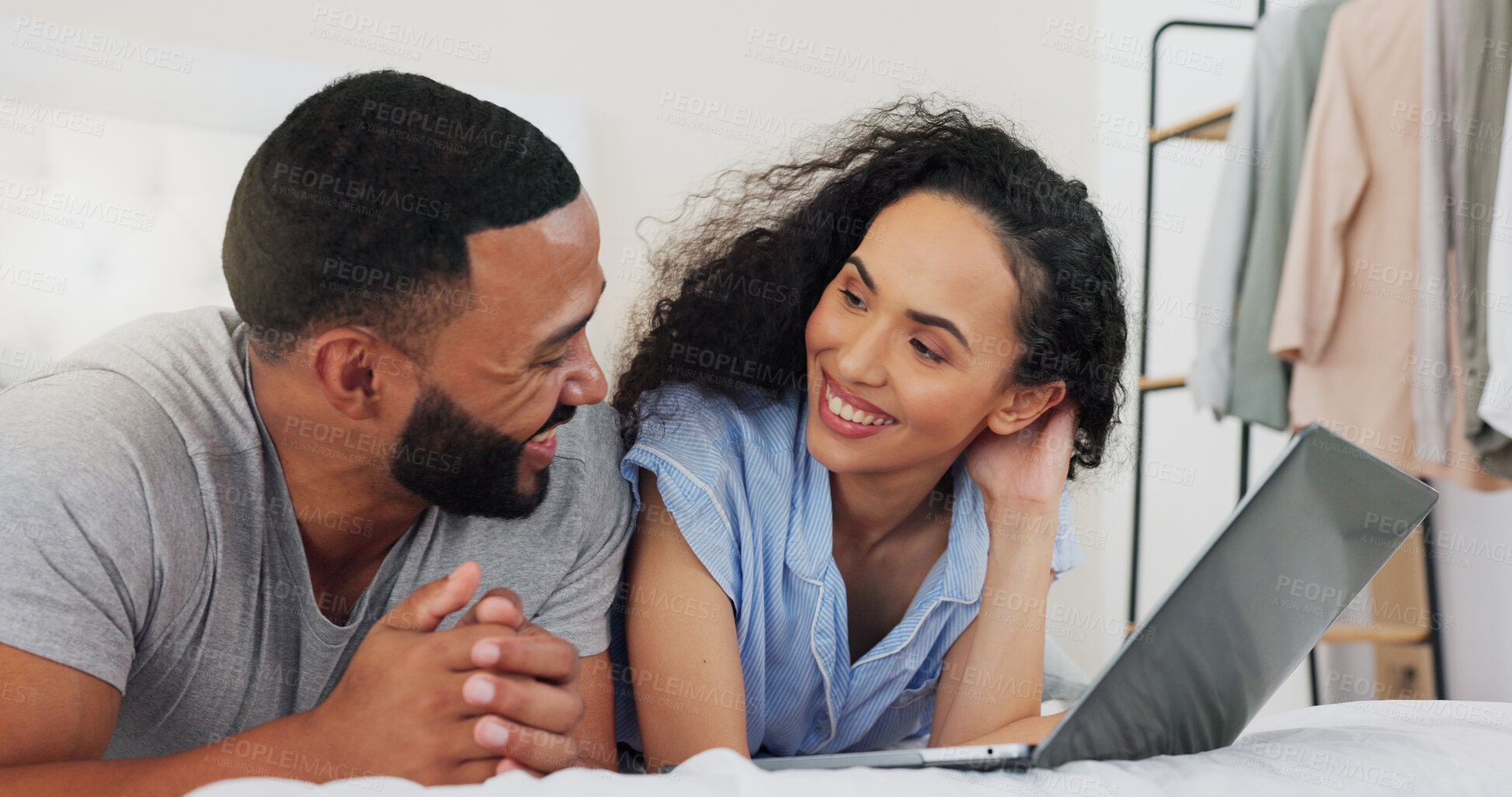 Buy stock photo Couple, laptop and happy on bed in home with search for property with agreement to start family together. Man, woman and relax in bedroom with computer, discussion and smile for decision in house