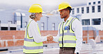 Business people, architect and engineer with handshake for construction, teamwork or meeting in city. Businessman, woman or contractors shaking hands for partnership, b2b or architectural agreement