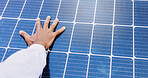 Solar panel, electrician and hand with light for renewable energy, alternative power or photovoltaic system. Closeup, technician and electrical heat grid for eco friendly resource or electricity