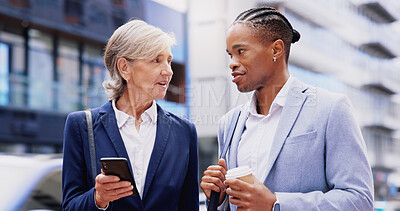 Buy stock photo City, business people and conversation in morning for walking, commute and travel to workplace. Urban, corporate team and employees with discussion for daily tasks, hot beverage and phone outdoor