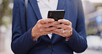 Business woman, hands and typing with phone in city for communication, email or texting. Closeup, female person or employee with mobile smartphone for chatting, connectivity or network in urban town