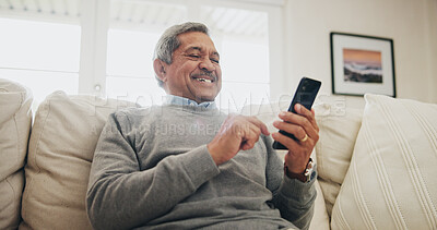 Buy stock photo Home, senior man on sofa and smartphone with typing, internet and message for contact, texting and relax. Mature person, apartment and elderly guy on couch, cellphone and mobile user with network